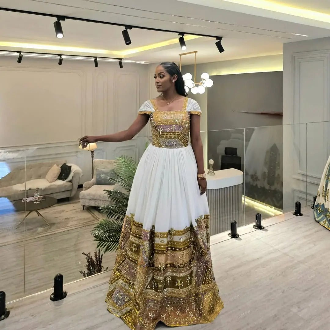 Shimmering Golden Habesha Dress: Beaded Cross Ornaments on Traditional Ethiopian Dress Gorgeous Ethiopian Wedding Dress