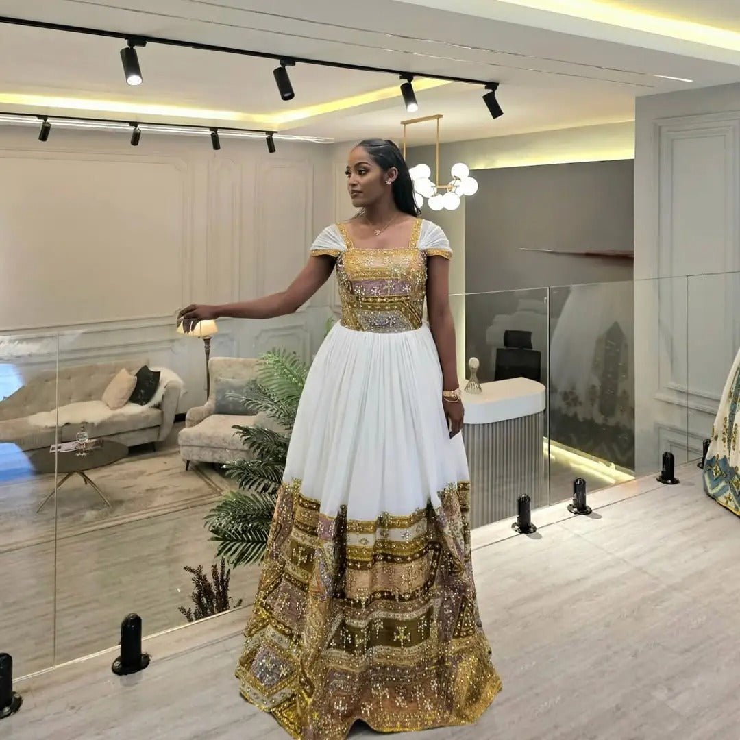 Shimmering Golden Habesha Dress: Beaded Cross Ornaments on Traditional Ethiopian Dress Gorgeous Ethiopian Wedding Dress