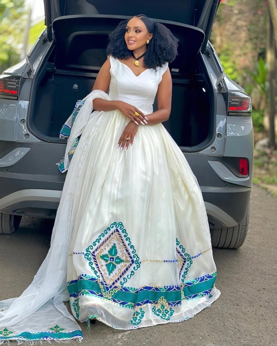 Chic and Effortless Habesha Kemis with Striking Green and Blue Hem Embroidery