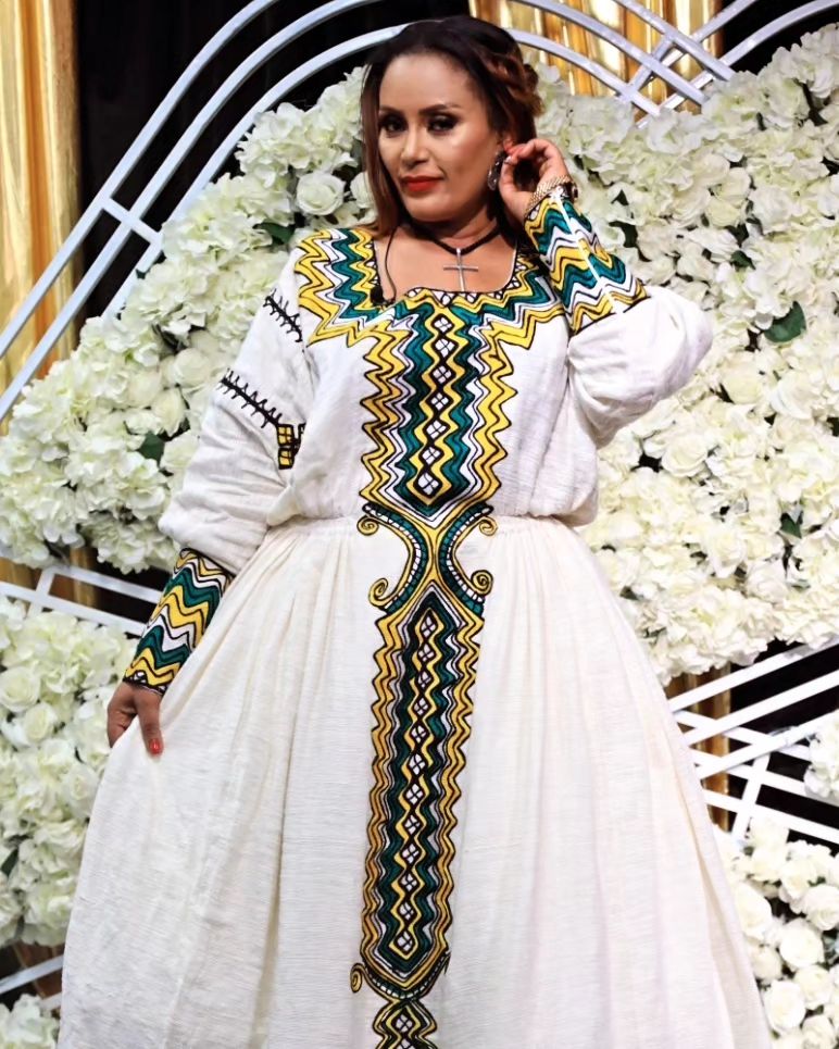 Artistry in Green: Intricately Patterned Tilet Habesha Kemis, a Fusion of Fetil Fabric and Cotton Elegance