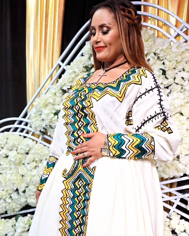 Artistry in Green: Intricately Patterned Tilet Habesha Kemis, a Fusion of Fetil Fabric and Cotton Elegance