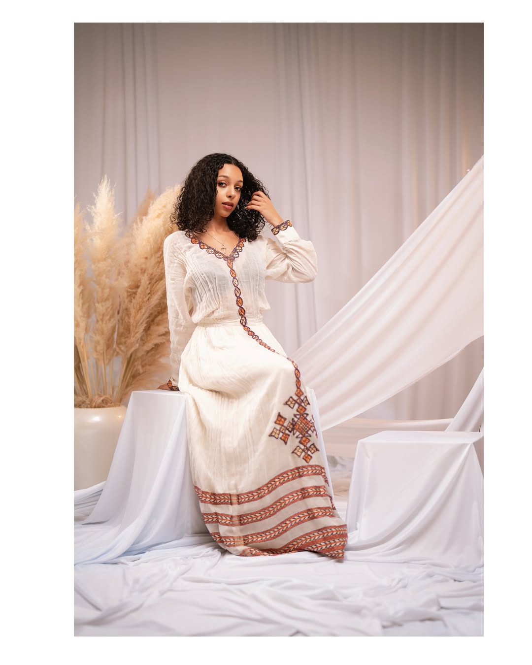 Effortless Elegance: Classic Habesha Kemis with Refined Red Detailing