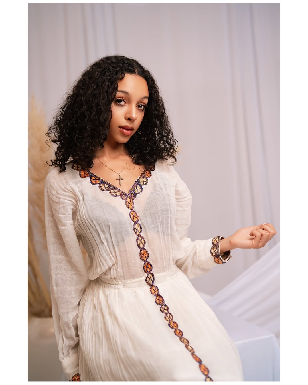 Effortless Elegance: Classic Habesha Kemis with Refined Red Detailing