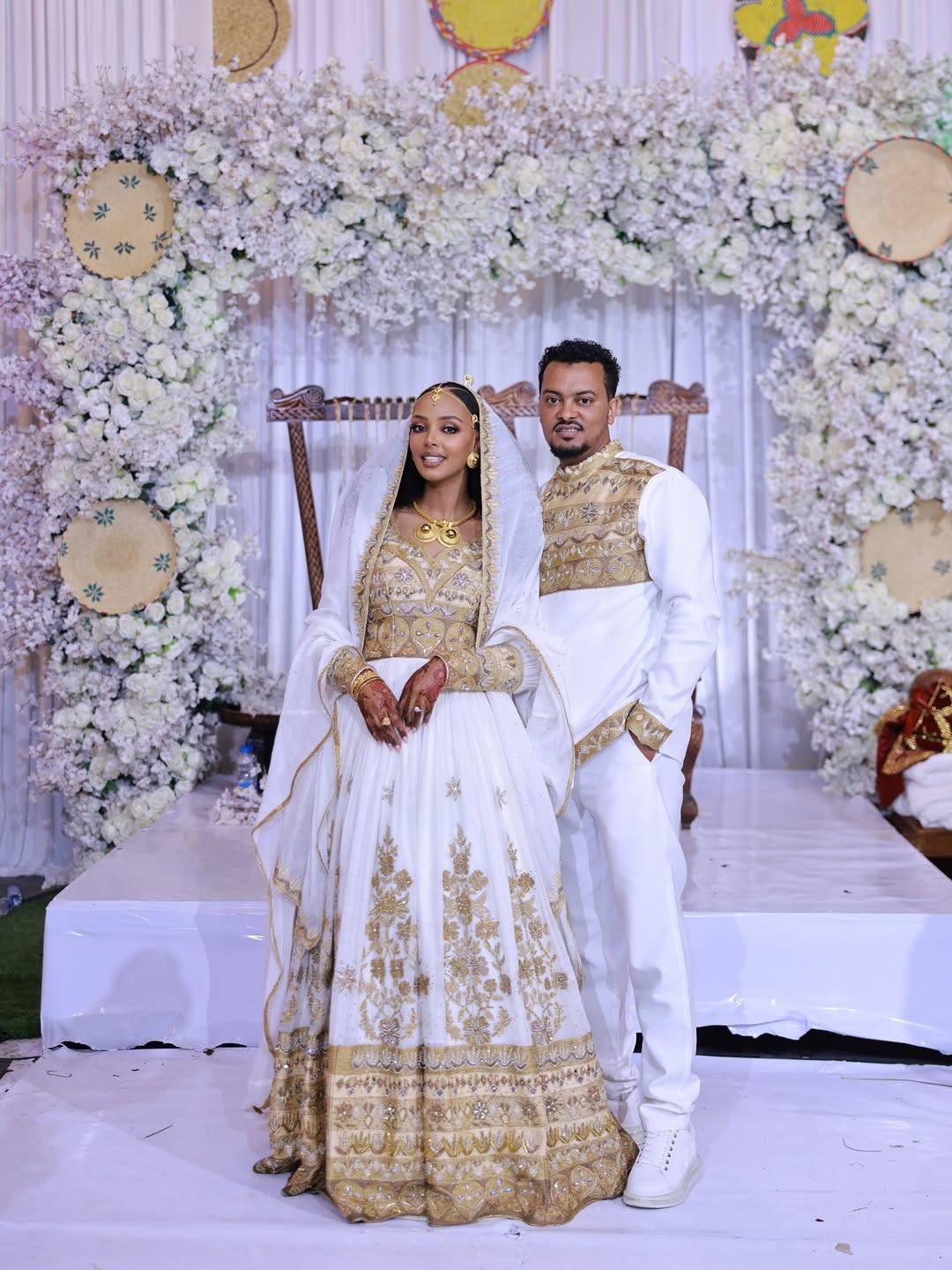 Regal Ethiopian Couple's Outfits with Gold Embroidery β Traditional Bridal Wear