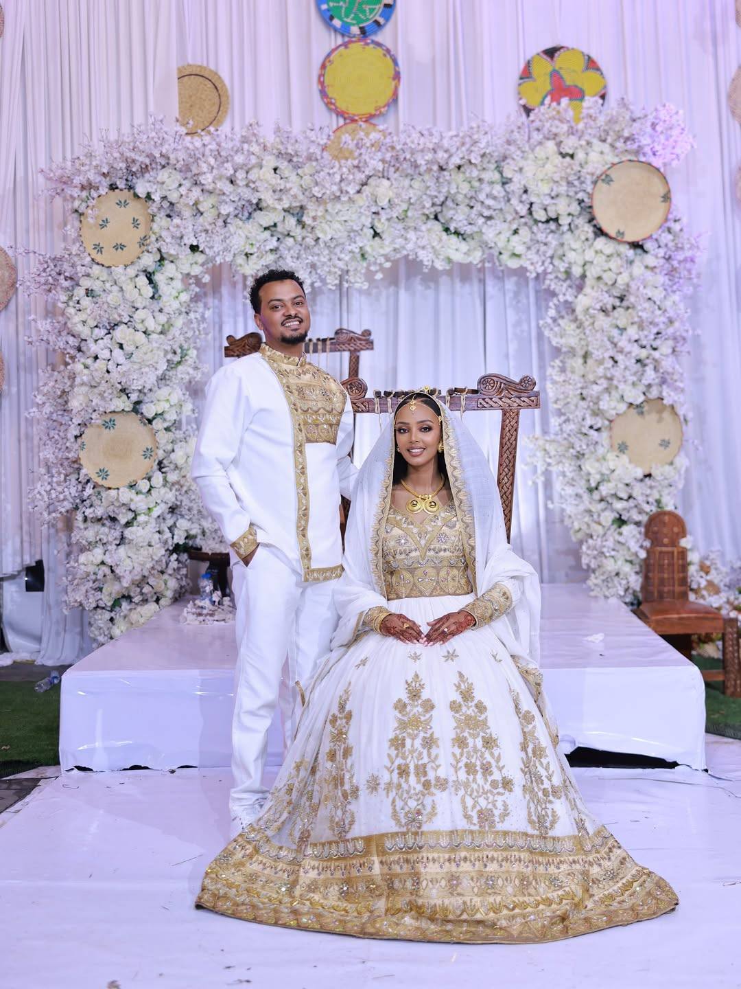 Regal Ethiopian Couple's Outfits with Gold Embroidery β Traditional Bridal Wear