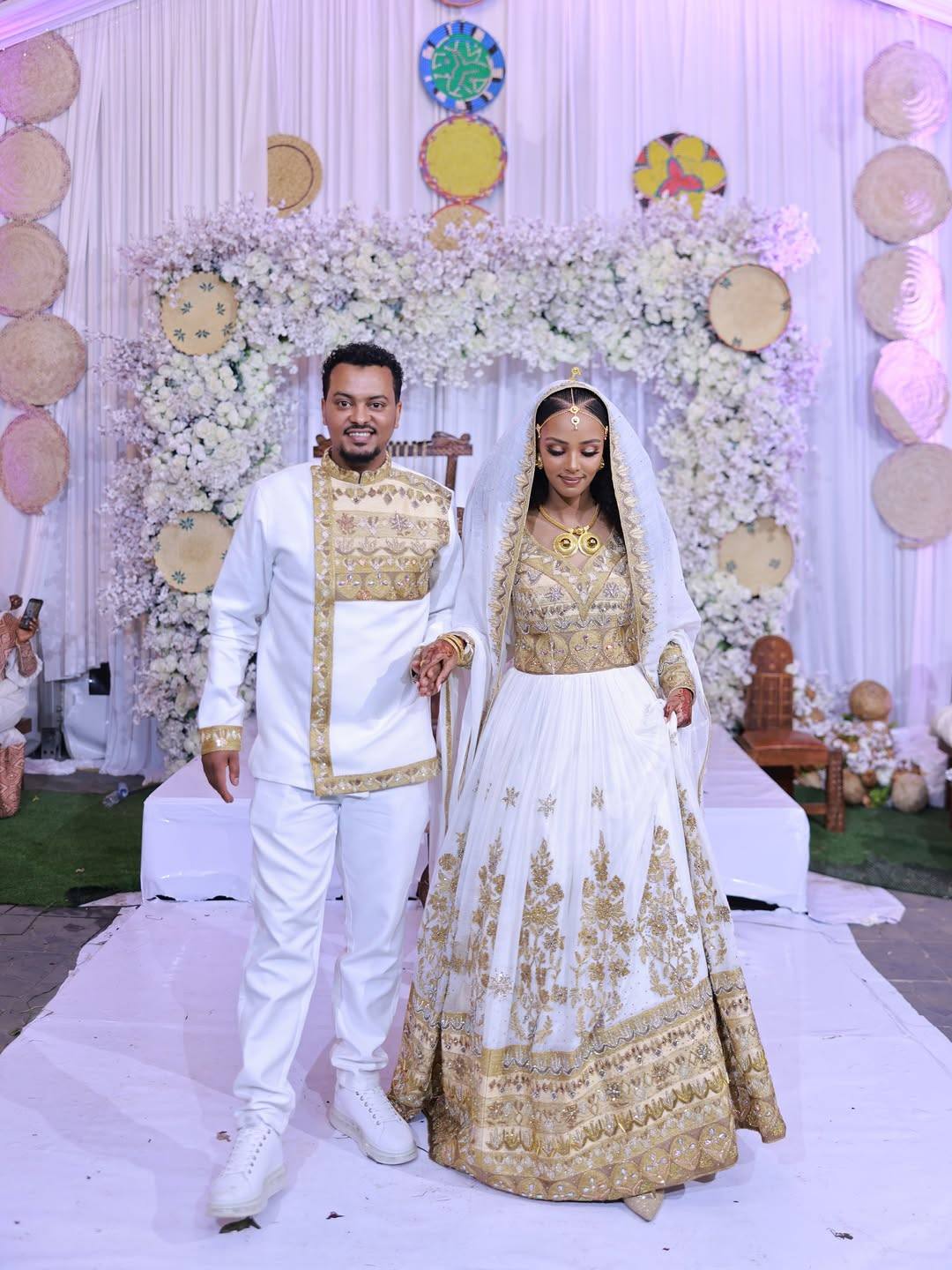 Regal Ethiopian Couple's Outfits with Gold Embroidery β Traditional Bridal Wear
