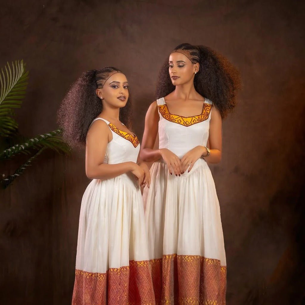 Elegant Habesha Kemis with Vibrant Red And Yellow Embroidery for Special Occasions