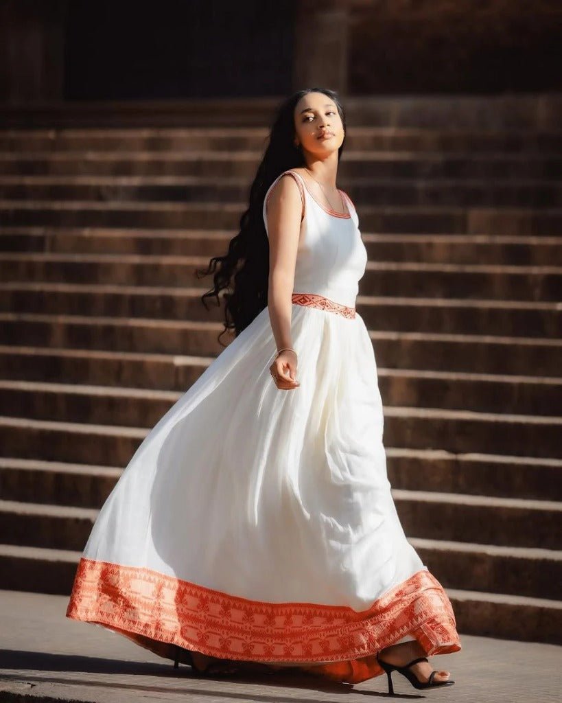 Simple Habesha Kemis with Bold Red Embroidery for an Event