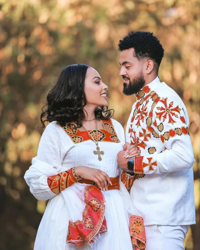 Elegant Habesha Wedding Couple’s Outfit with Rich Red and Gold Embroidery for Your Special Day