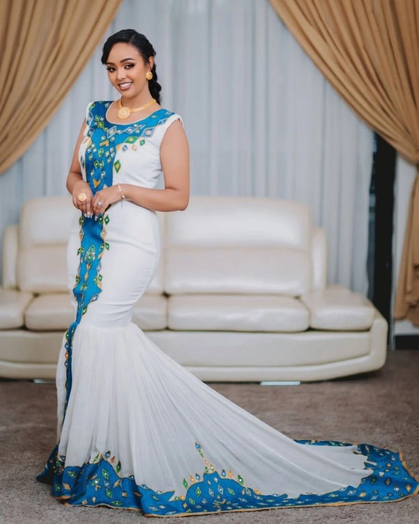 Stylish Couple in Traditional Attire with Blue Accents – Habesha Dress – Habesha Wedding Dress – Cultural Dress