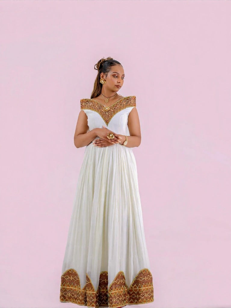 Unique Habesha Kemis Design with Brown and Gold Geometric Accents for Wedding