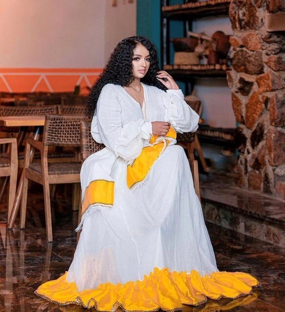 Sunshine in Menen Fabric: A Radiant Yellow Habesha Kemis