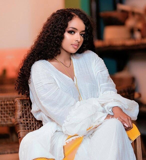 Sunshine in Menen Fabric: A Radiant Yellow Habesha Kemis