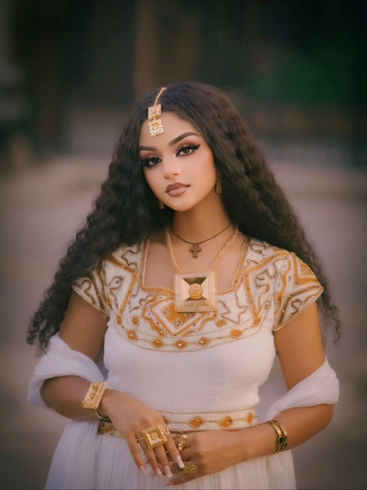 Elegant Traditional Ethiopian Clothing in Gold and White