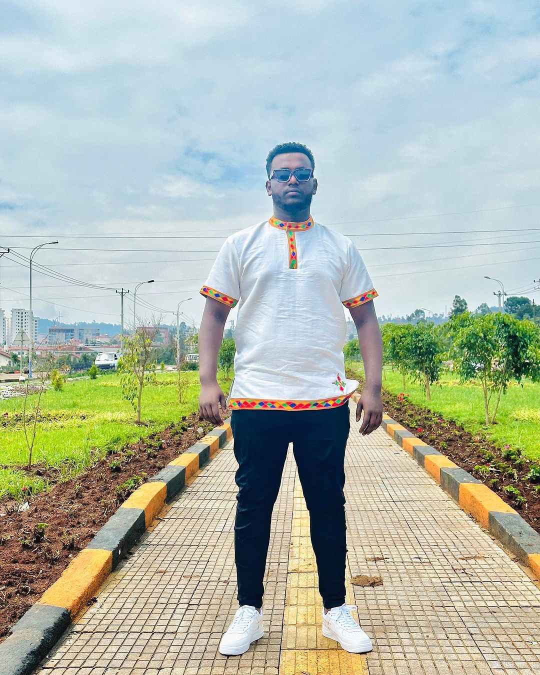 Vibrant Heritage: Handwoven Colorful Pattern Habesha Men's Shirt - A Kaleidoscope of Ethiopian Style