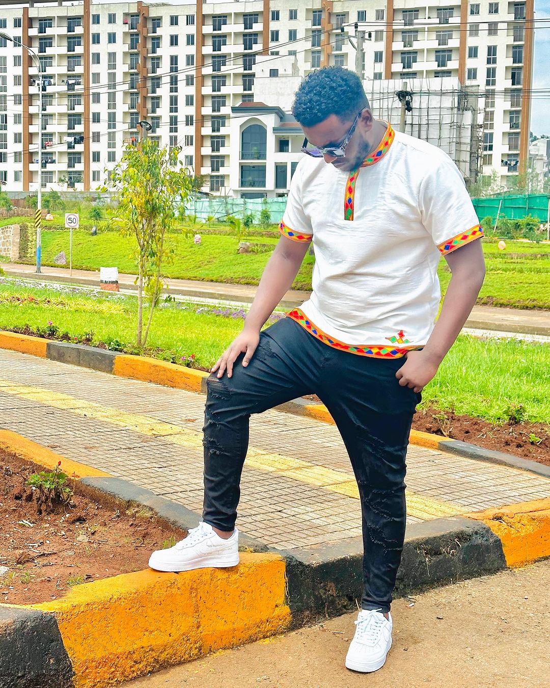 Vibrant Heritage: Handwoven Colorful Pattern Habesha Men's Shirt - A Kaleidoscope of Ethiopian Style