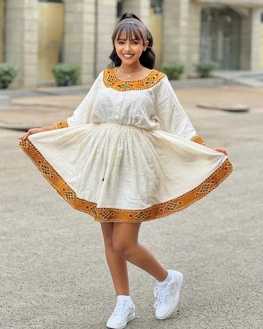 Breezy Habesha Chic: Embracing the Essence of Tradition in a Short Ethiopian Kemis
