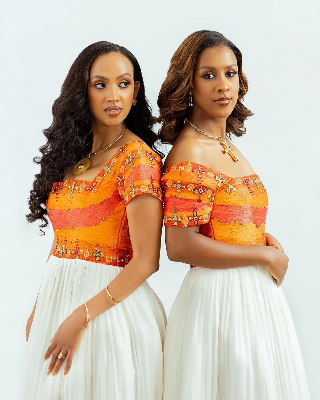 Radiant Elegance: Embrace the Splendor of Habesha Kemis - Vibrant Orange Ethiopian Dress