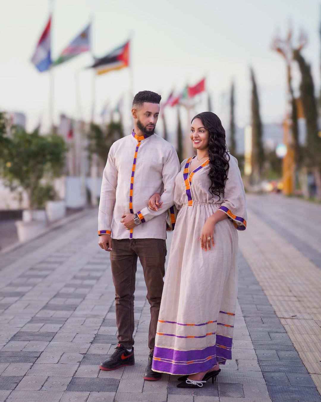 Purple and Orange Design Habesha Couples Outfit Modern Ethiopian