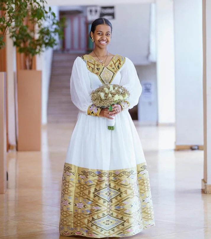 Captivating Golden Traditional Ethiopian Wedding Dress: with Intricate Patterns On Wide Hemline Habesha Wedding Dress for Cultural Events S Captivating Golden Traditional Ethiopian Wedding Dress: with Intricate Patterns On Wide Hemline Habesha Wedding Dress for Cultural Events S