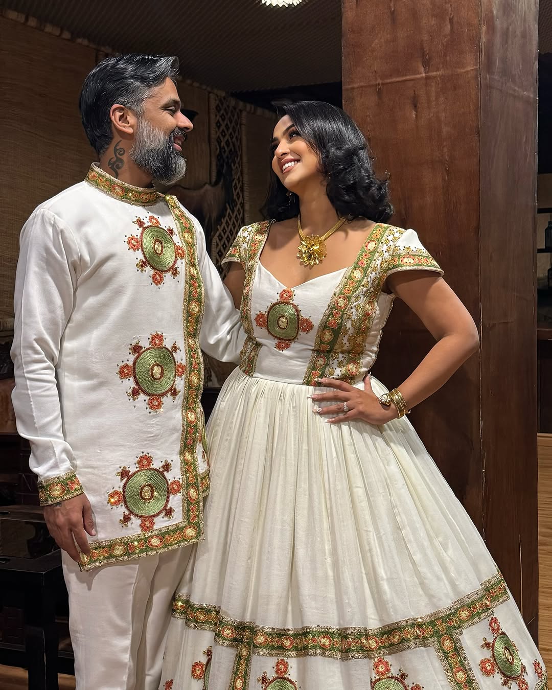 Vibrant Habesha Wedding Dress with Intricate Multicolor Embroidery