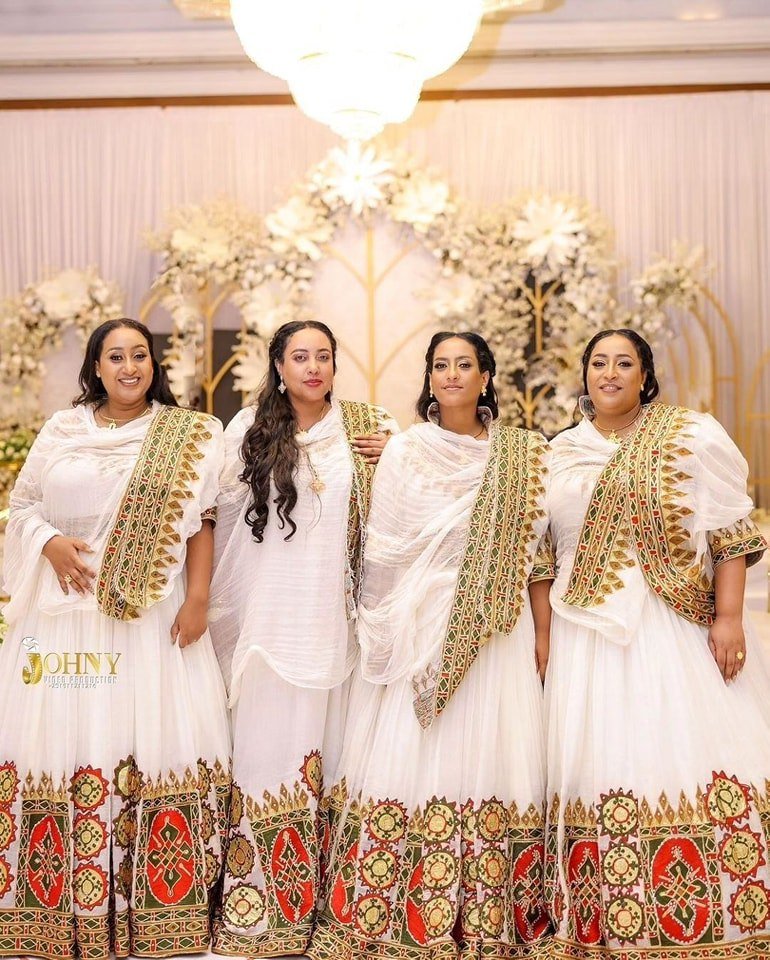 Flowing Multicolored Ethiopian Dress: Luxurious Celebration Attire for Joyful Events