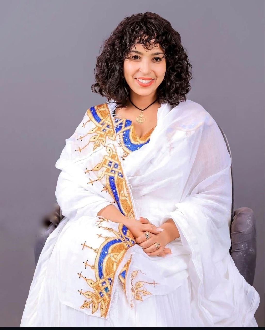 Radiant Golden and Blue Tilet Habesha Dress Elegant Cultural Attire