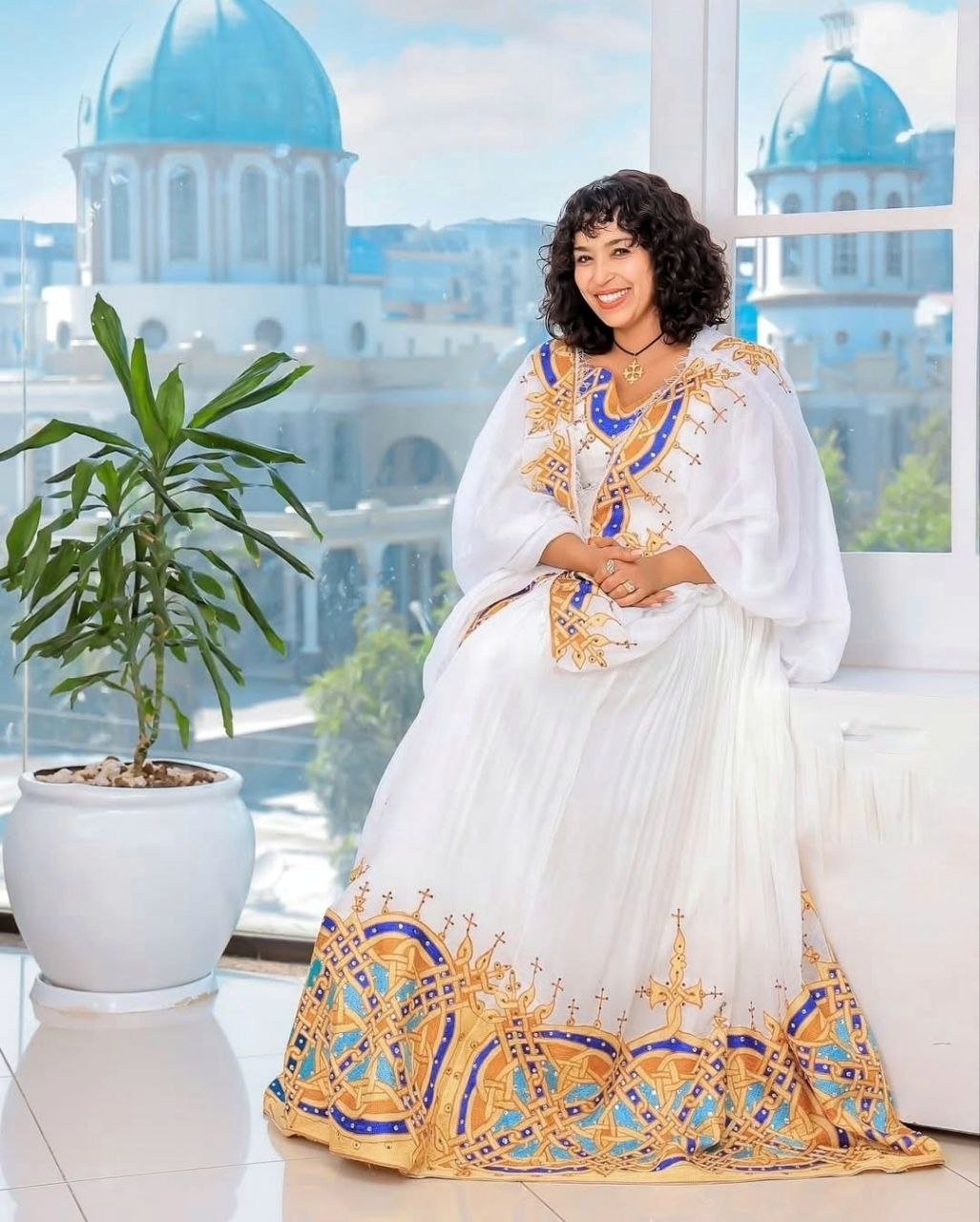 Radiant Golden and Blue Tilet Habesha Dress Elegant Cultural Attire