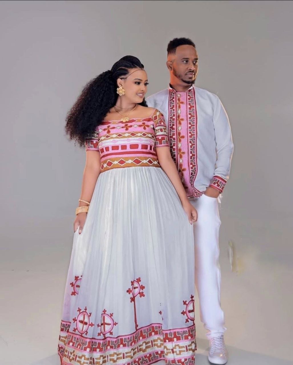 Striking Couple's Habesha Dress Set with Bold Red, Pink & Gold Embroidery