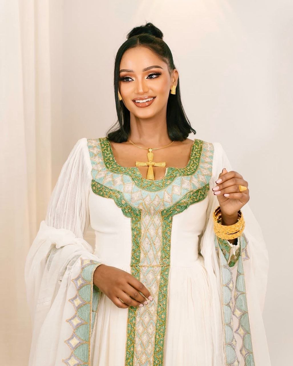 Graceful Traditional Ethiopian Dress with Green & Gold Cross Embroidery for Celebration