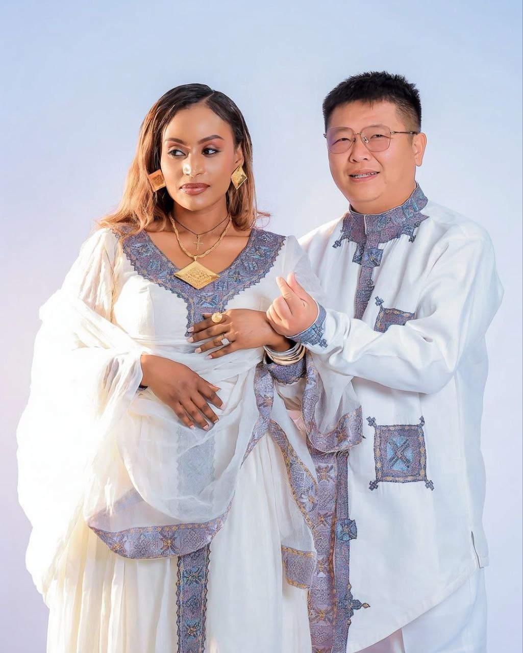 Elegant Habesha Couple Outfit with Soft Lavender Embroidery for Ethiopian Weddings