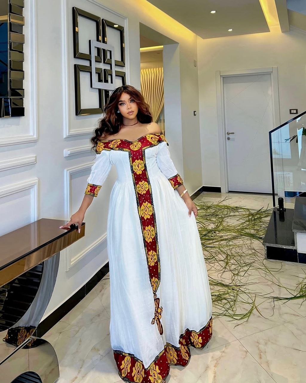 Elegant Off-Shoulder Habesha Dress with Bold Red Tilf Modern Ethiopian Dress for Festive Occasions