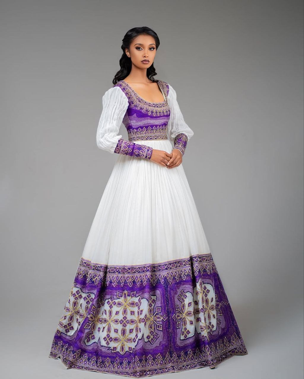 Glamorous Habesha Dress with Intricate Purple Embroidery: A Beautiful Ethiopian Wedding Dress