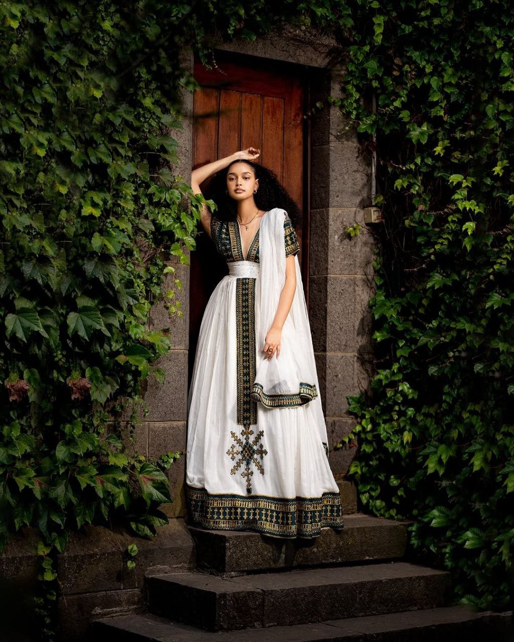 Elegant Traditional Ethiopian Dress with Rich Green and Gold Embroidery for Cultural Celebrations
