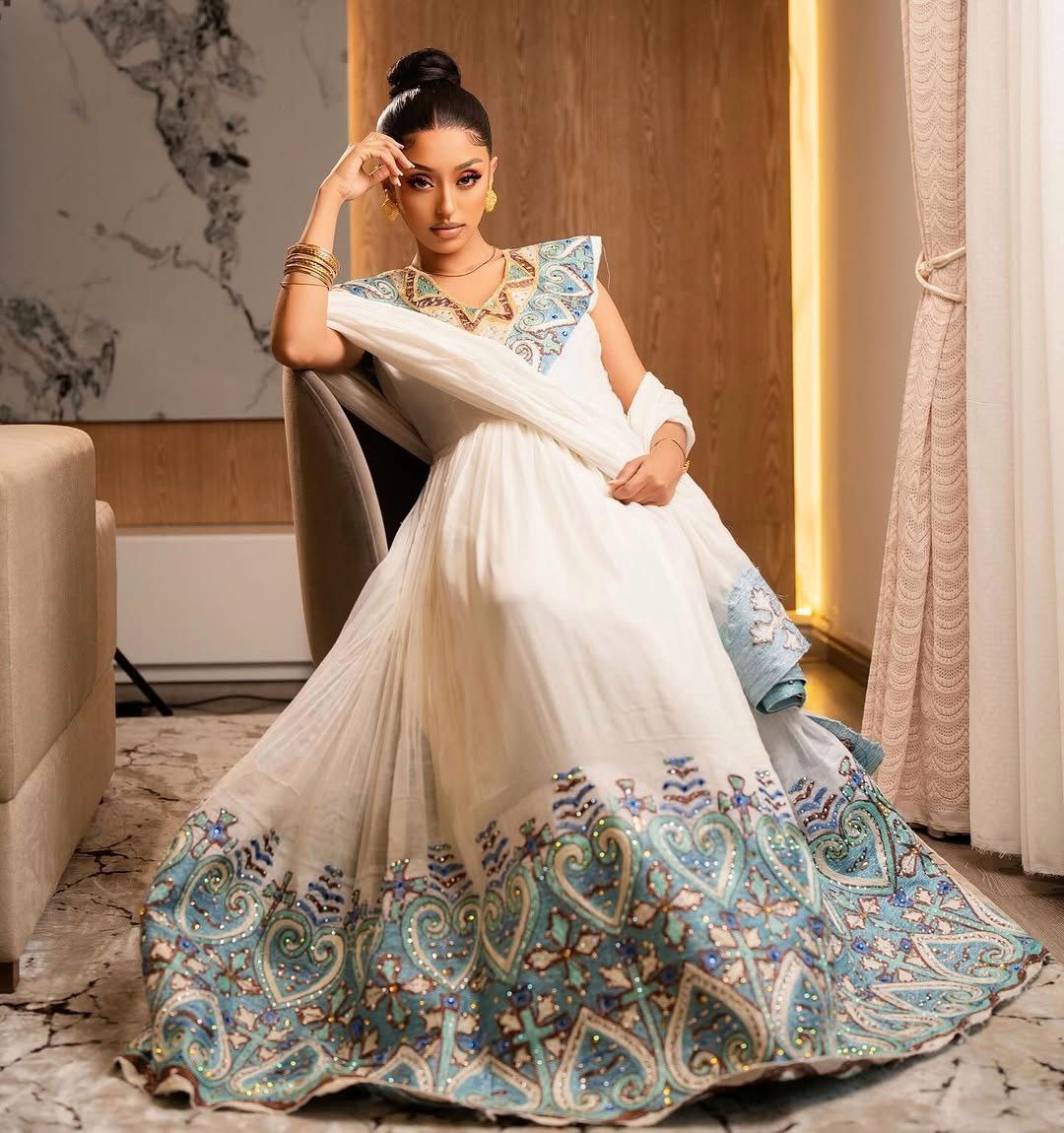Elegant Habesha Kemis with Blue Embroidery and Royal Shoulder Detail for Ceremonies