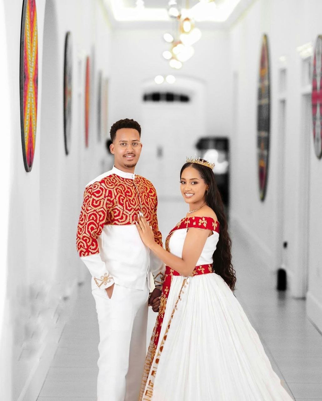 Bold Red and Gold Habesha Couple Outfit with Royal Embroidery for Weddings and Celebrations