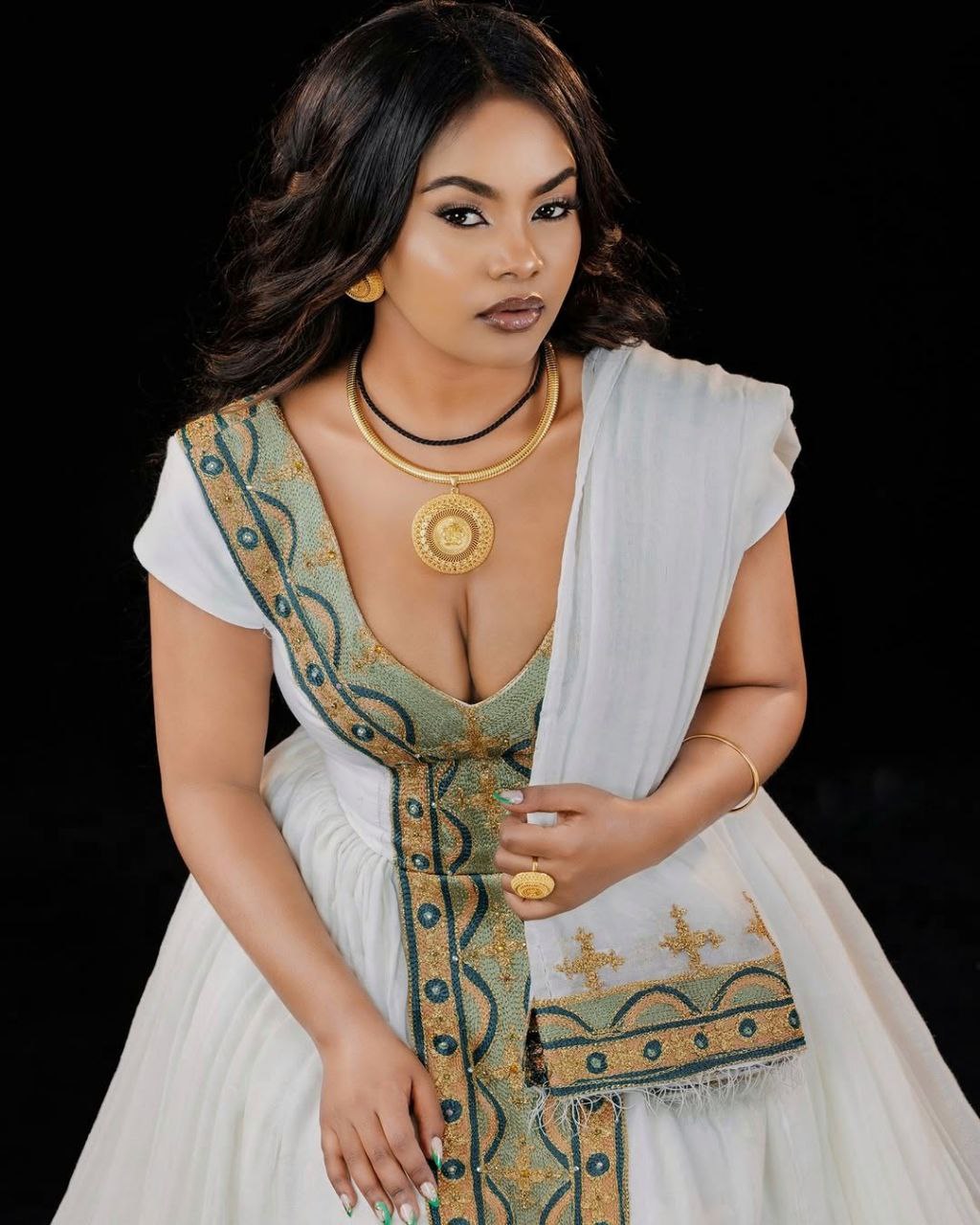 Chic Traditional Ethiopian Dress with Gold and Green Embroidered Kemis for Cultural Celebration
