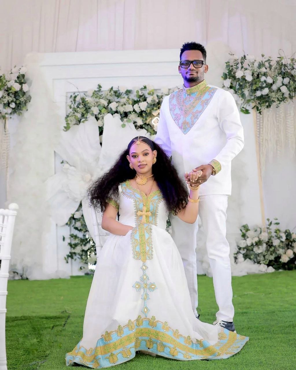 Regal Habesha Couple Outfit with Gold and Aqua Blue Wedding Dress and Matching Men’s Set for Traditional Ceremonies