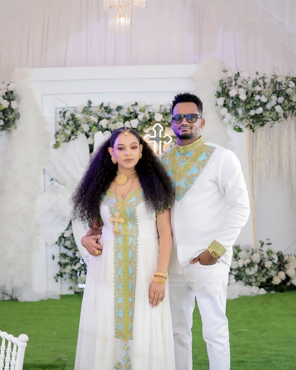 Regal Habesha Couple Outfit with Gold and Aqua Blue Wedding Dress and Matching Men’s Set for Traditional Ceremonies