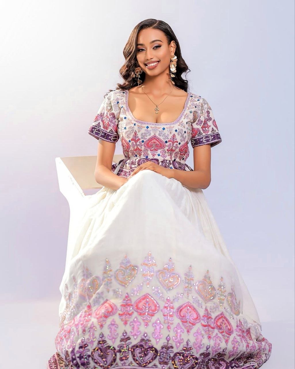 Elegant Habesha Kemis with Pink and Plum Embroidery for Wedding Celebrations