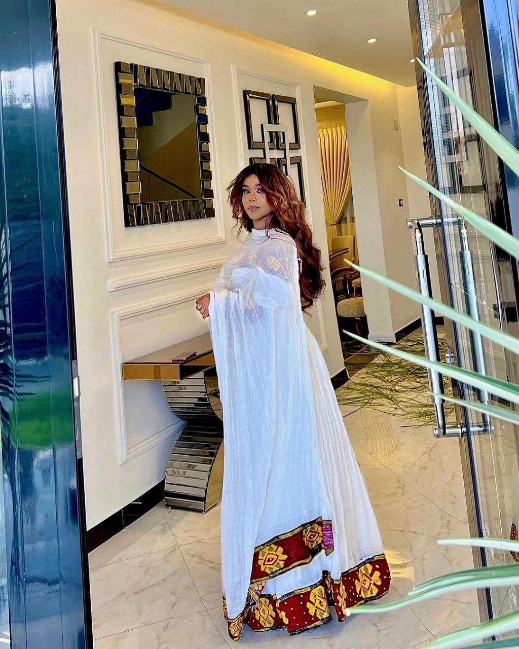 Elegant Off-Shoulder Habesha Dress with Bold Red Tilf Modern Ethiopian Dress for Festive Occasions