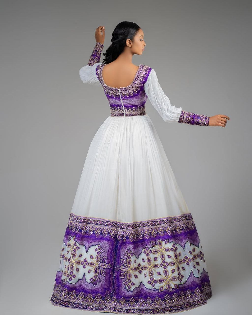 Glamorous Habesha Dress with Intricate Purple Embroidery: A Beautiful Ethiopian Wedding Dress