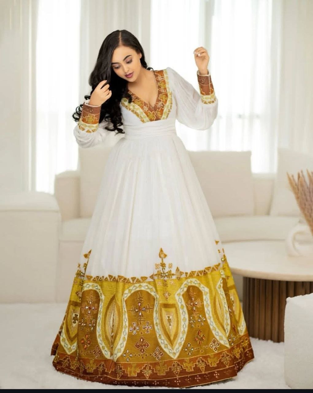 Stunning Habesha Dress with Luxurious Gold Embroidery for Weddings