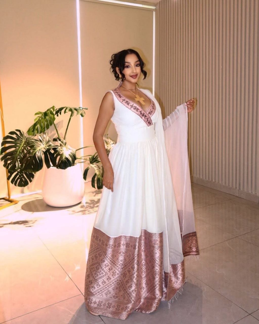 Graceful Modern Habesha Dress with Blush Pink Tibeb Borders For Celebration