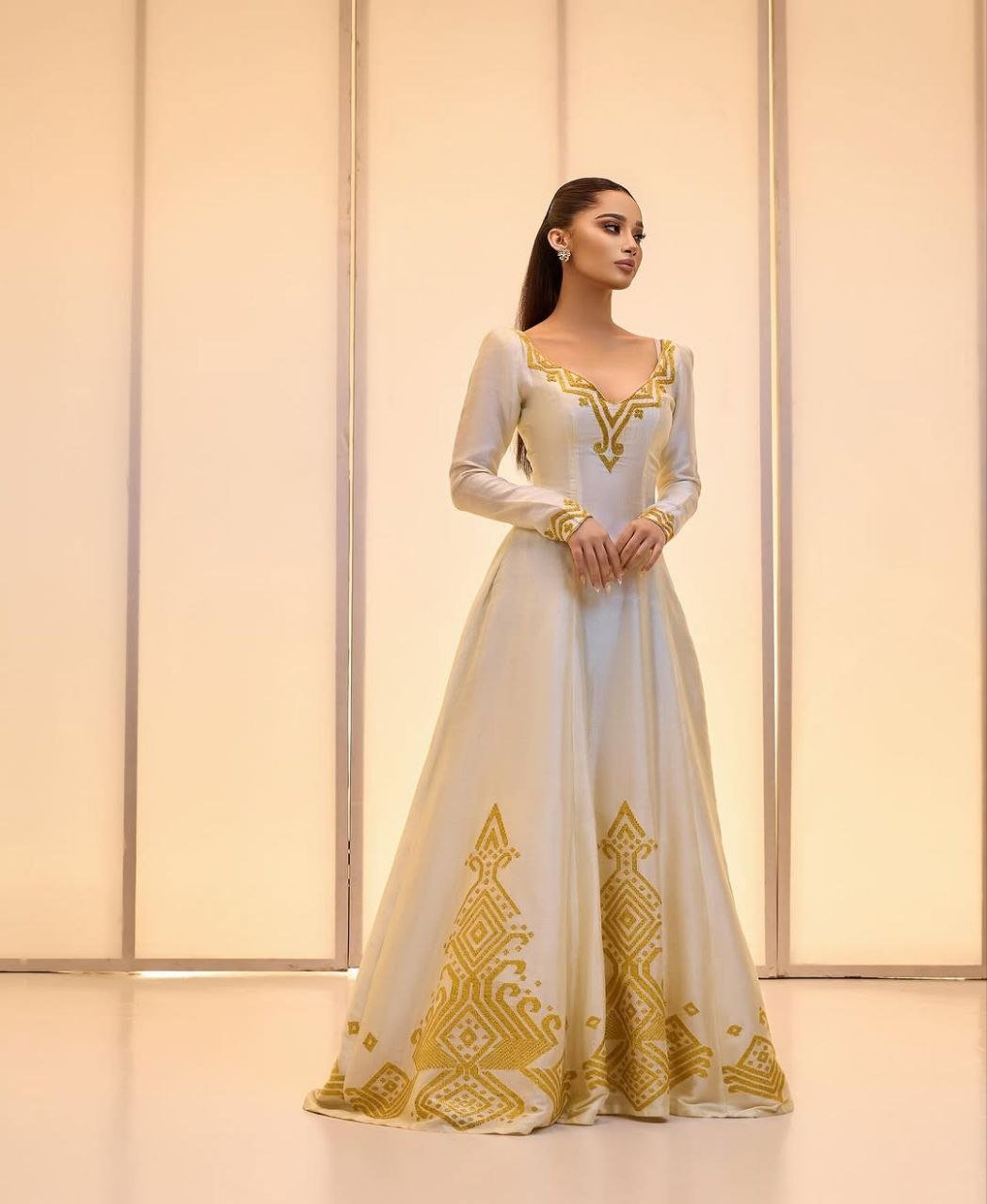 Elegant Ivory Habesha Wedding Dress with Intricate Gold Embroidery For Wedding