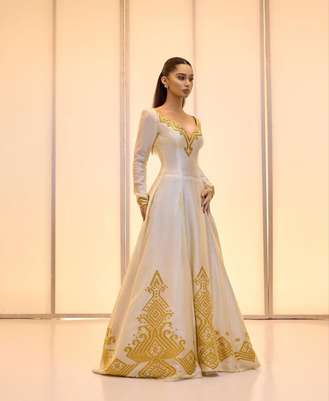 Elegant Ivory Habesha Wedding Dress with Intricate Gold Embroidery For Wedding
