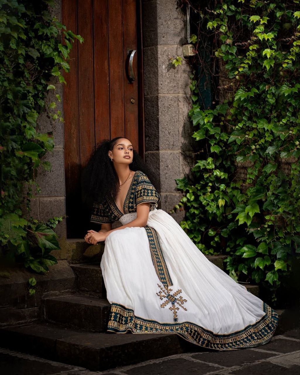 Elegant Traditional Ethiopian Dress with Rich Green and Gold Embroidery for Cultural Celebrations