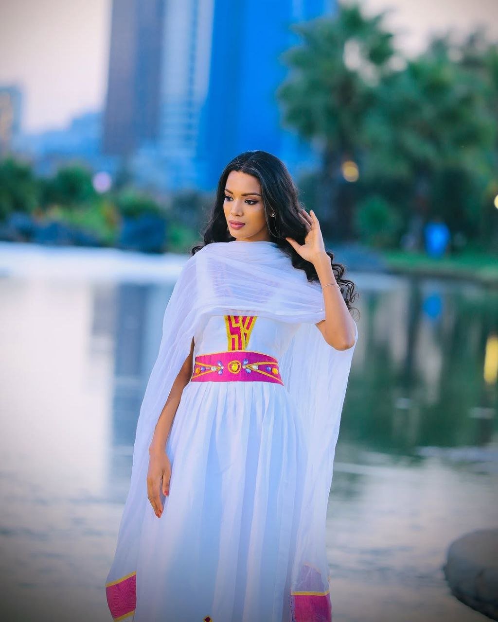 Simple Habesha Dress with Vibrant Pink and Gold Embroidery for Special Occasions