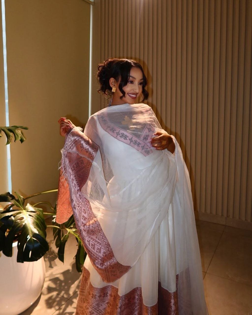 Graceful Modern Habesha Dress with Blush Pink Tibeb Borders For Celebration
