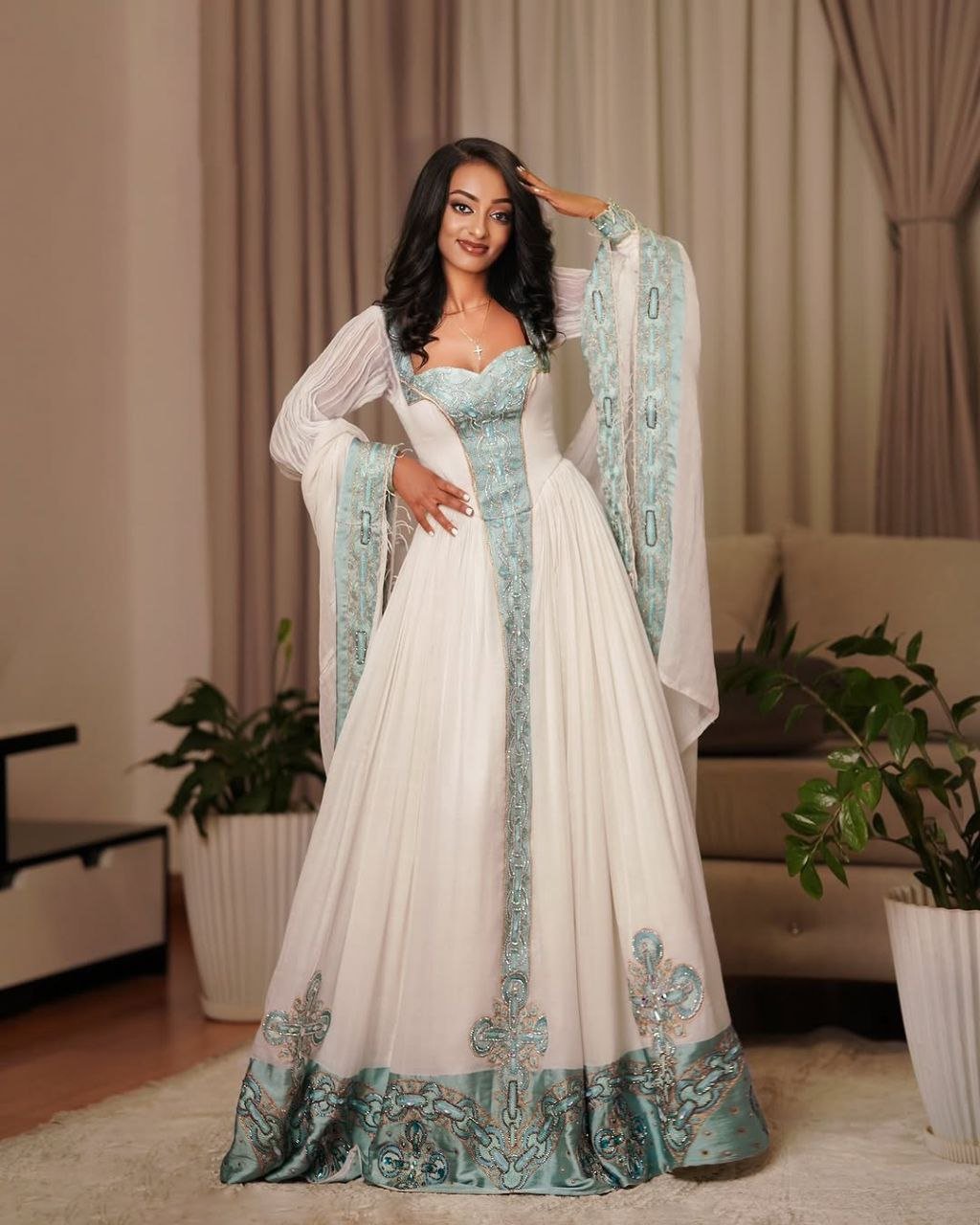 Elegant Habesha Dress with Aqua Blue Embroidery for Special Occasions